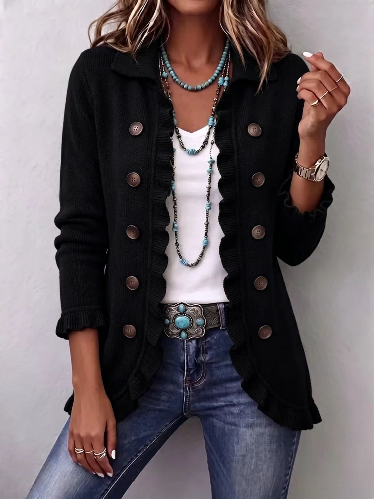 Luz · Chaqueta de punto negra con volantes