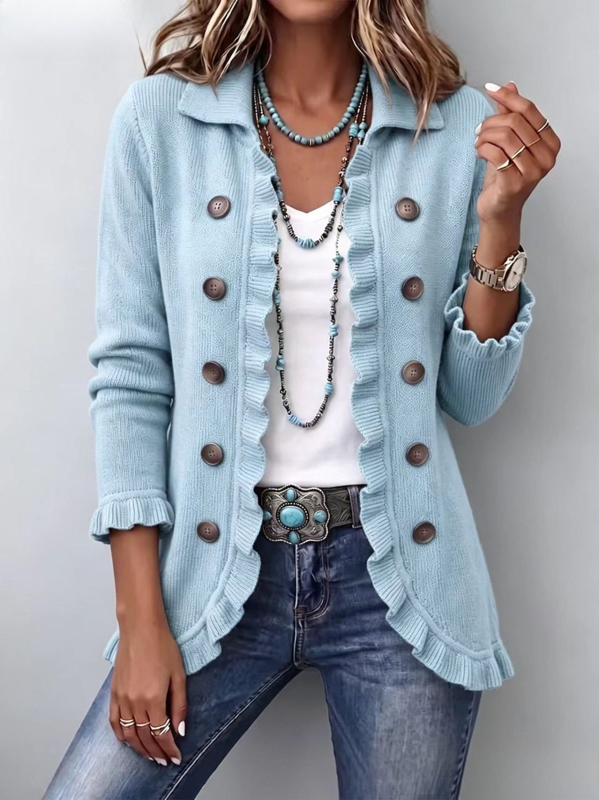 Sagrario · Chaqueta de punto azul con volantes